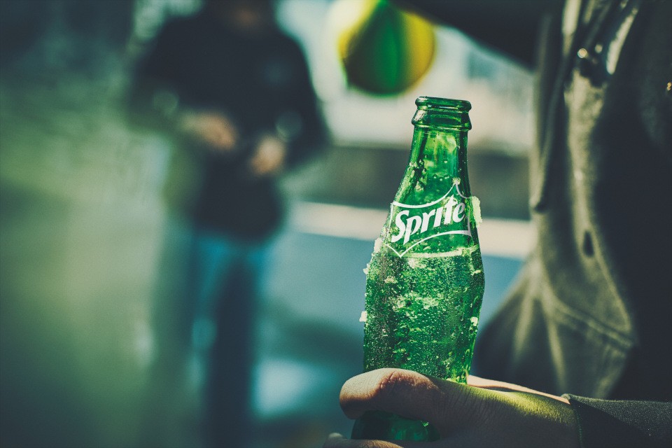 Sprite bottle in hand