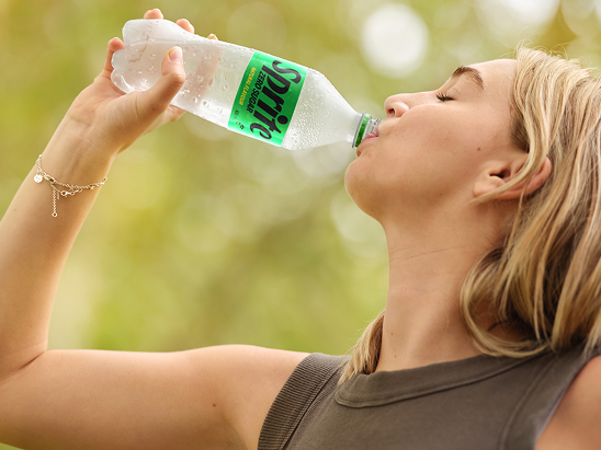 Hands of a person holding a handful of grains